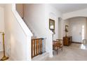 Bright entryway features staircase with safety gate, archways, and direct access to living area at 2160 Brandon Park Cir, Brandon, FL 33510