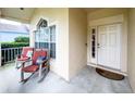 Cozy front porch featuring rocking chairs for relaxing outdoor seating and decorative pillows at 2160 Brandon Park Cir, Brandon, FL 33510