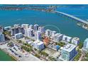 A stunning aerial view of the condo community, perfectly situated on the water with easy access to the bay at 226 Golden Gate Pt # 63, Sarasota, FL 34236