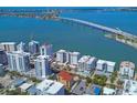 Beautiful aerial view of the condo building situated in a vibrant neighborhood near the bay and bridge at 226 Golden Gate Pt # 63, Sarasota, FL 34236