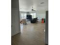 Spacious living room featuring modern floors, natural lighting, and a ceiling fan at 5094 Bunyan St, Sarasota, FL 34232