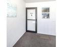 Condo front entry door with decorative welcome art is perfect for a beach vacation at 5669 Midnight Pass Rd # 308, Sarasota, FL 34242