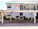 Beautiful condo exterior features covered parking, well-maintained landscaping, and a welcoming entrance at 5669 Midnight Pass Rd # 308, Sarasota, FL 34242