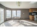 Bright dining area featuring natural light, neutral walls, and carpeted floors at 5829 Coventry Dr, Tampa, FL 33615