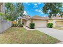 Charming single-Gathering home with a well-manicured lawn and a two-car garage at 7885 Bristol Park Dr, Apollo Beach, FL 33572