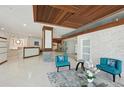 A modern lobby with a decorative ceiling, tile floors, and modern decor at 101 S Gulfstream Ave # 6C, Sarasota, FL 34236