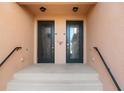 Elegant double front doors with decorative glass inserts offer privacy and architectural detail at 10820 Tarflower Dr # 202, Venice, FL 34293