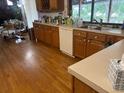Functional kitchen boasting ample cabinet space, a double sink, and hardwood flooring at 1212 Candlewood Dr, Lakeland, FL 33813