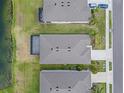 An aerial shot of the roof shows the property line and proximity to the lake at 13915 Mount Laurel Trl, Bradenton, FL 34211
