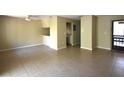 Open living space with neutral walls and tile flooring at 2729 Hidden Lake Blvd # D, Sarasota, FL 34237