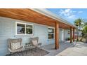 Inviting front porch featuring a seating area with stylish chairs and attractive design elements at 2825 Pinecrest St, Sarasota, FL 34239