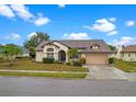 Inviting single-story home showcasing a well-maintained lawn and attached two-car garage at 4621 34Th E Ct, Bradenton, FL 34203