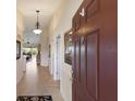 Entryway featuring tile floors, archways, and an open view into the home's living spaces at 7179 Boca Grove Pl # 202, Lakewood Ranch, FL 34202