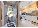 Inviting home featuring an eat-in kitchen, white cabinets, and an exterior view at 805 Waterside Ln # 805, Bradenton, FL 34209