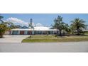 Single-Gathering home with a manicured lawn, two-car garage, and an inviting facade at 1021 Estremadura Dr, Bradenton, FL 34209