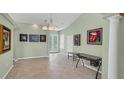 Bright living room features tile flooring, column details, and lots of space at 1108 64Th Street E Ct, Bradenton, FL 34208