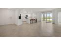 Spacious kitchen featuring modern appliances and an island with barstool seating at 12680 Radiance Ct # 12-101, Venice, FL 34293