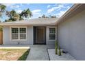 Inviting front entrance with well-maintained landscaping, featuring cacti and white rock against a freshly painted exterior at 1345 24Th St, Sarasota, FL 34234