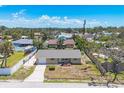 Aerial view of a single-story home featuring a well-maintained lawn and a one-car garage at 1533 Olympia Rd, Venice, FL 34293