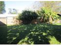 Spacious backyard with privacy fence offers ample room for outdoor activities at 1909 6Th W Ave, Palmetto, FL 34221