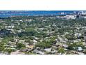 Expansive aerial view showcasing the property's location within a lush, established neighborhood near the waterfront at 2516 Goldenrod St, Sarasota, FL 34239