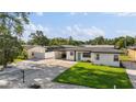 Well-maintained home featuring fresh white paint, a carport, and a spacious yard in a desirable location at 2715 Herwald St, Sarasota, FL 34231