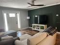 Cozy living room featuring wood floors, modern decor, and ample natural light at 2722 9Th Ave W, Bradenton, FL 34205