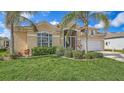 Charming single Gathering home boasts a lush landscaped yard and attached two car garage at 4274 Tennyson Way, Venice, FL 34293