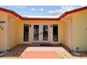 Inviting front entrance with double doors and decorative tile flooring at 4829 Commonwealth Rd, Palmetto, FL 34221