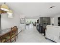 Spacious open-concept living room featuring tile flooring and recessed lighting at 4829 Commonwealth Rd, Palmetto, FL 34221