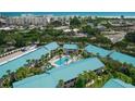 Aerial view of community featuring a refreshing pool area surrounded by beautifully maintained grounds at 5681 Midnight Pass Rd # 104, Sarasota, FL 34242