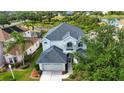 Aerial view of a well-maintained home, showcasing its architectural design and landscaping at 6307 Laurel Creek Trl, Ellenton, FL 34222