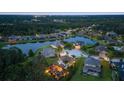 An aerial view of the community with lake views and well-maintained properties at 6907 47Th E Ct, Ellenton, FL 34222