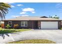 Beautiful home featuring a two-car garage, driveway, with meticulously maintained landscaping and lawn at 710 Beverly Rd, Venice, FL 34293