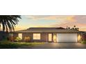 Home with a well-manicured lawn and colorful plants that accentuate the front, highlighting a desirable curb appeal at 710 Beverly Rd, Venice, FL 34293