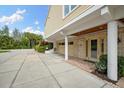 Spacious garage with brick accent and ample parking on a concrete driveway at 76 Tidy Island Blvd, Bradenton, FL 34210