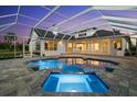 A beautiful private pool with a built-in spa and covered screen at 7832 Panther Ridge Trl, Bradenton, FL 34202