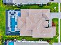 Overhead view of expansive home with private pool, spa and meticulously landscaped backyard at 8272 Redonda Loop, Bradenton, FL 34202