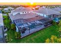 Aerial view of an enclosed pool and spa area perfect for relaxation and entertainment at 8272 Redonda Loop, Bradenton, FL 34202