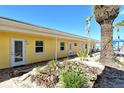 Cozy beach condo exterior with well-maintained landscaping, sandy ground, and a lovely view of the beach at 105 Casey Key Rd # 20, Nokomis, FL 34275