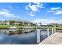 Scenic waterfront view with boats docked along the canal, showcasing the community's access to boating and water activities at 1355 Rock Dove Ct # 1-2, Punta Gorda, FL 33950