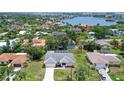 Stunning aerial view of a residential neighborhood with waterfront access, showcasing the property's prime location and surroundings at 1626 Ridgewood Ln, Sarasota, FL 34231