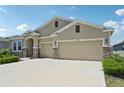 Charming single-story home with a two-car garage and stone accents and inviting curb appeal at 17536 Cantarina Cv, Bradenton, FL 34211