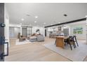 Spacious open-concept living area with modern finishes, a dining area and lots of natural light at 1801 W Saint Isabel St, Tampa, FL 33607