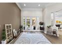 Spacious living room with views of the pool and patio at 2152 Majestic Oaks Blvd, Clearwater, FL 33759