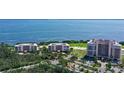 Breathtaking aerial view of the condo complex, golf course and beautiful bay at 3070 Grand Bay Blvd # 644, Longboat Key, FL 34228