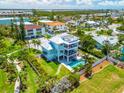 Beautiful backyard with a pool, patio, and rooftop deck, ideal for relaxation or entertaining at 3702 5Th Ave, Holmes Beach, FL 34217