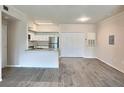 Open-concept kitchen featuring stainless steel appliances, granite countertops, and breakfast bar at 4142 Central Sarasota Pkwy # 1423, Sarasota, FL 34238