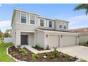 Charming two-story home featuring a neatly landscaped front yard and a spacious two-car garage at 4429 67Th E St, Bradenton, FL 34203