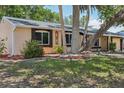 Charming single-story home with mature trees and decorative landscaping at 4468 Maraldo Ave, North Port, FL 34287